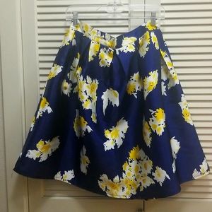 Full blue skirt with white and yellow flowers